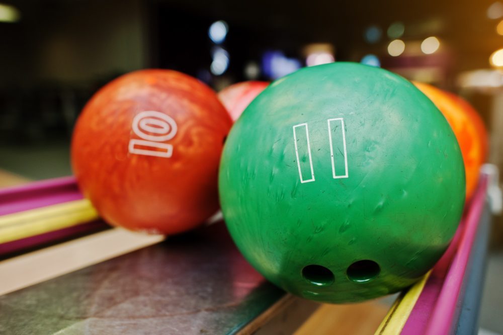 Two colored bowling balls of number 11 and 10