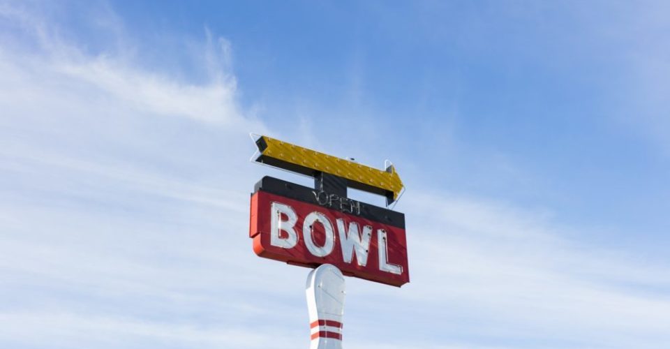 Vintage sign for bowling alley, Bowl white lettering on red background - ancient bowling ball