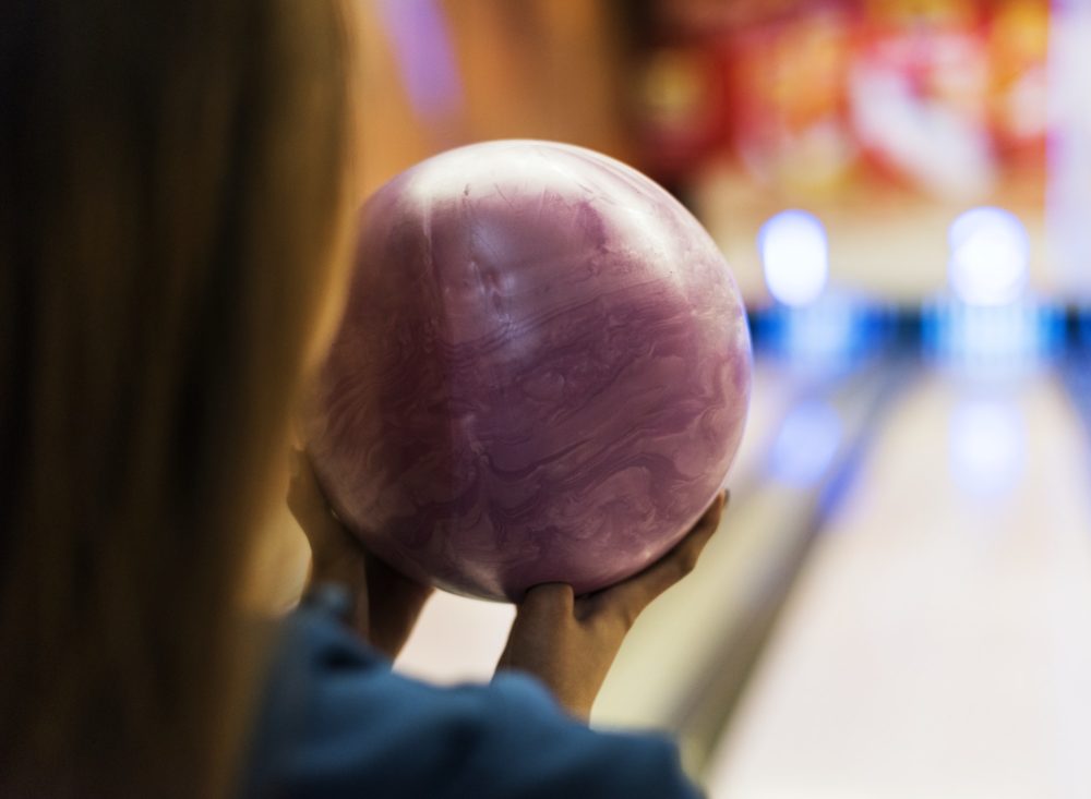 Girl with pink bowling ball