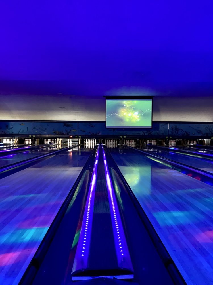Empty bowling lane with neon lights