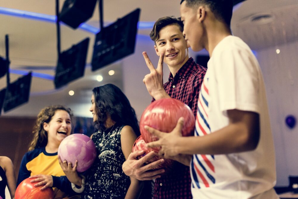 Friends bowling together after school